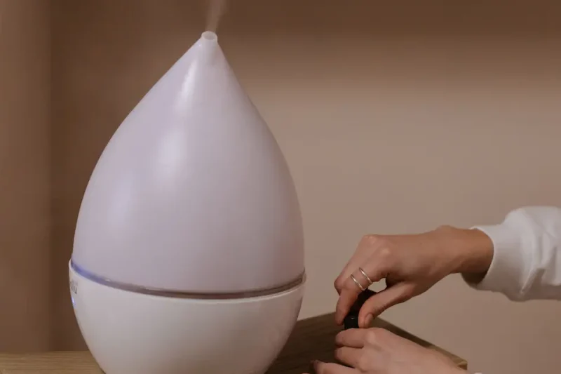woman prepares humidifer in bedroom